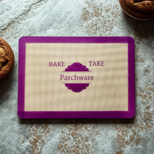 parchware baking mat on top of kitchen counter next to baked goods